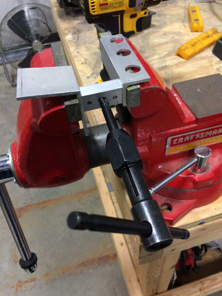 Tapping the forward strut attach points