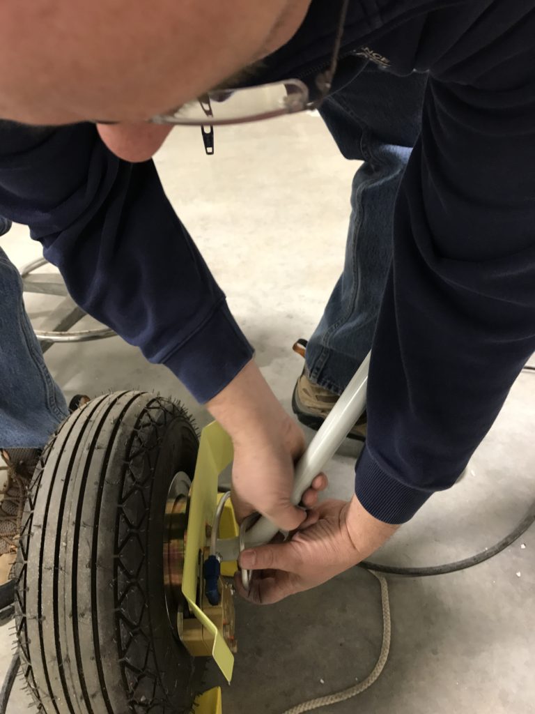 Dave adjusting the wheel end of a brake line