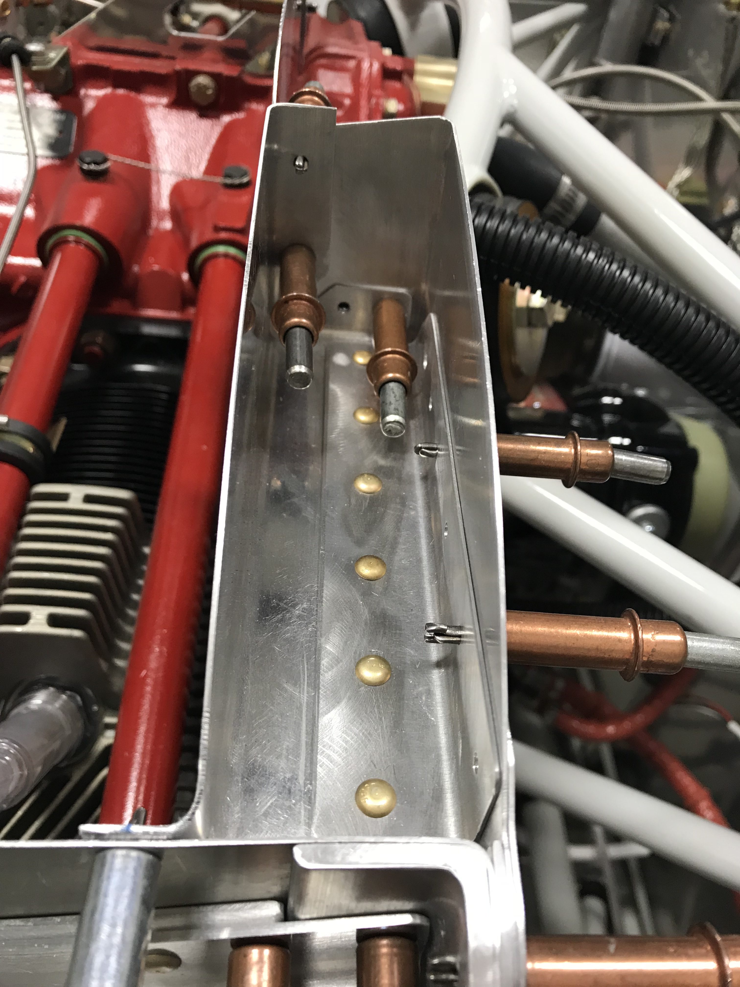 Oil cooler reinforcement riveting