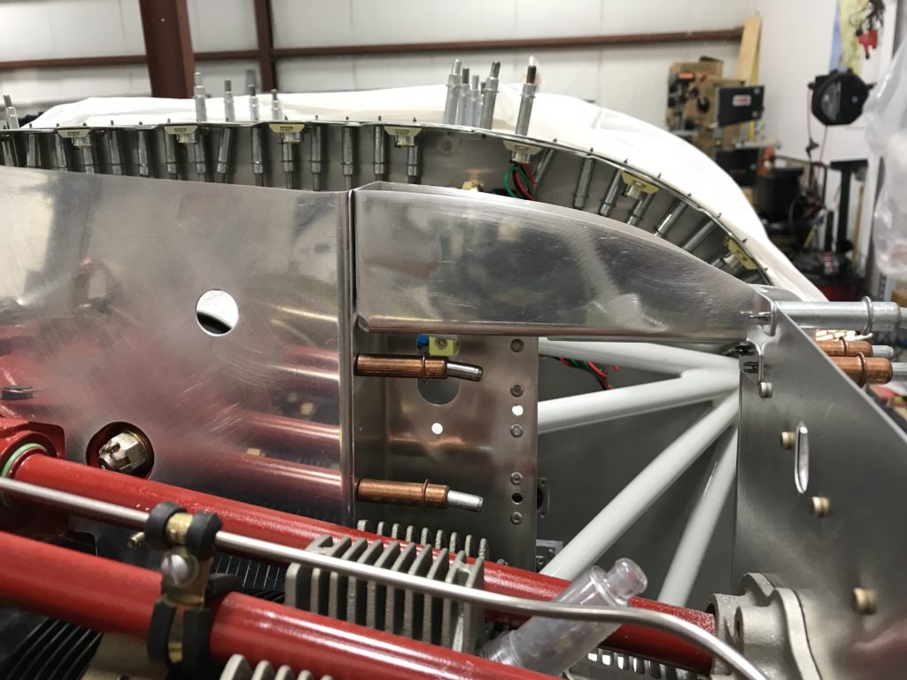 Oil cooler reinforcement front flange trimmed